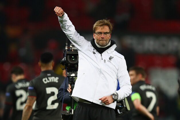 MANCHESTER, ENGLAND - MARCH 17:  Jurgen Klopp, manager of Liverpool celebrates a 3-1 aggregate victory after the UEFA Europa League round of 16 second leg match between Manchester United and Liverpool at Old Trafford on March 17, 2016 in Manchester, England.  (Photo by Clive Brunskill/Getty Images)
