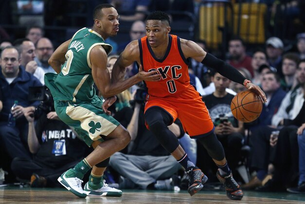 Oklahoma City Thunder's Russell Westbrook, right, drives past Boston Celtics' Avery Bradley, during the second quarter of an NBA basketball game in Boston, Wednesday, March 16, 2016. (AP Photo/Michael Dwyer)