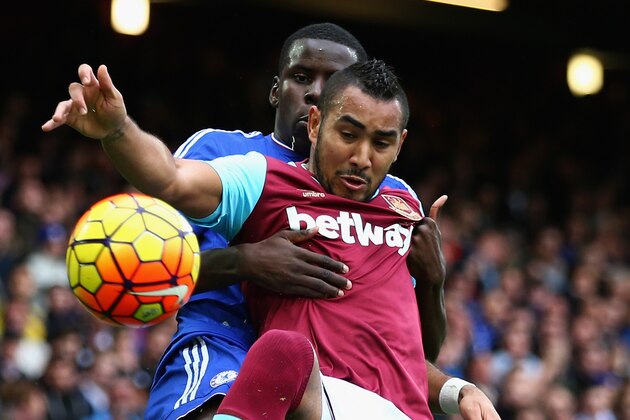 LONDON, ENGLAND - OCTOBER 24:  Dimitri Payet of West Ham United and Kurt Zouma of Chelsea compete for the ball during the Barclays Premier League match between West Ham United and Chelsea at Boleyn Ground on October 24, 2015 in London, England.  (Photo by Clive Rose/Getty Images)