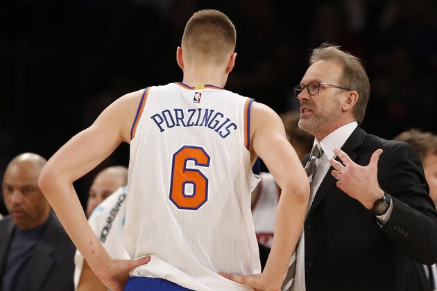 New York Knicks interim coach Kurt Rambis talks to forward Kristaps Porzingis during a timeout in the second half of the team's NBA basketball game against the Portland Trail Blazers at Madison Square Garden in New York, Tuesday, March 1, 2016. The Blazers won 104-85. (AP Photo/Kathy Willens)