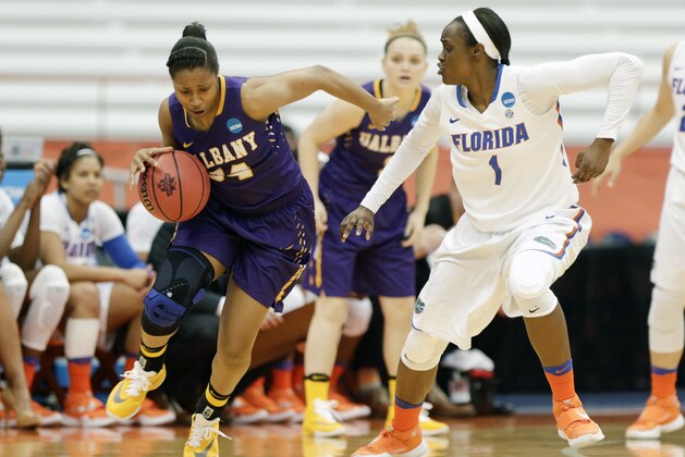 Albany guard Cassandra Edwards (34) drives against Florida guard Ronni Williams (1) during a first half of a first-round women's college basketball game in the NCAA Tournament on Friday, March 18, 2016, in Syracuse, N.Y. (AP Photo/Mike Groll) Albany guard Cassandra Edwards (34) drives against Florida guard Ronni Williams (1) during a first half of a first-round women's college basketball game in the NCAA Tournament on Friday, March 18, 2016, in Syracuse, N.Y. (AP Photo/Mike Groll)