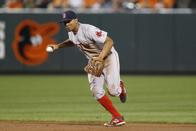 Boston Red Sox shortstop Xander Bogaerts fields a ball during a baseball game against the Baltimore Orioles, Tuesday, Sept. 15, 2015, in Baltimore. (AP Photo/Patrick Semansky)