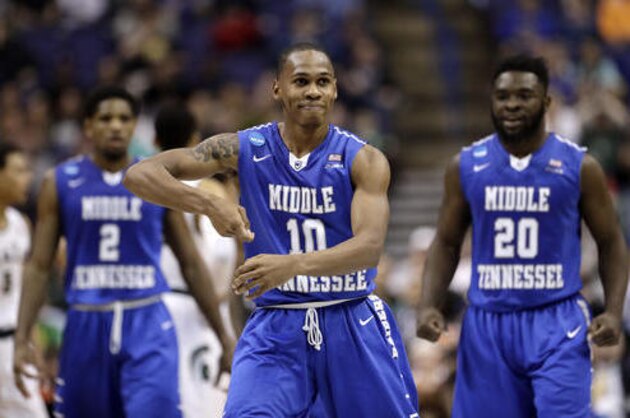Middle Tennessee's Jaqawn Raymond (10) celebrates after making a basket during the first half of a first-round men's college basketball game against Michigan State in the NCAA Tournament, Friday, March 18, 2016, in St. Louis. (AP Photo/Charlie Riedel)