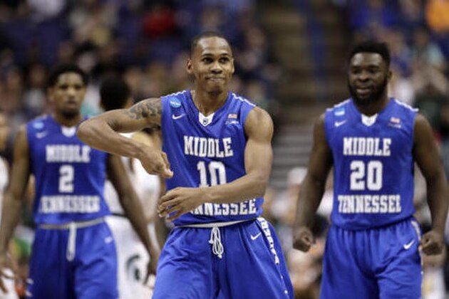 Middle Tennessee's Jaqawn Raymond (10) celebrates after making a basket during the first half of a first-round men's college basketball game against Michigan State in the NCAA Tournament, Friday, March 18, 2016, in St. Louis. (AP Photo/Charlie Riedel)