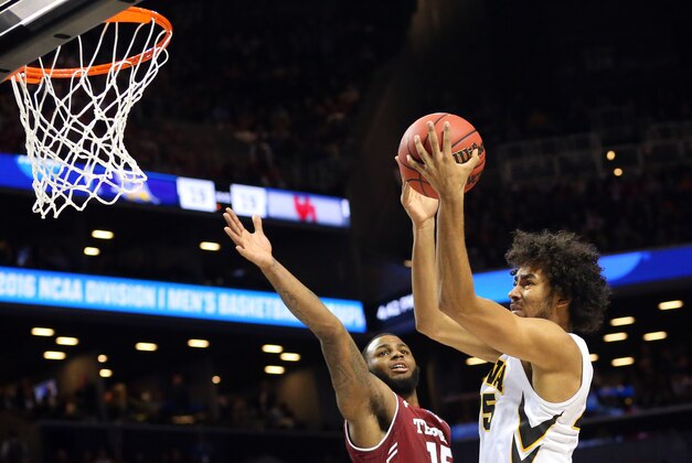 Mar 18, 2016; Brooklyn, NY, USA; Iowa Hawkeyes forward Dom Uhl (25) shoots against Temple Owls forward Jaylen Bond (15) in the second half in the first round of the 2016 NCAA Tournament at Barclays Center. Mandatory Credit: Anthony Gruppuso-USA TODAY Sports