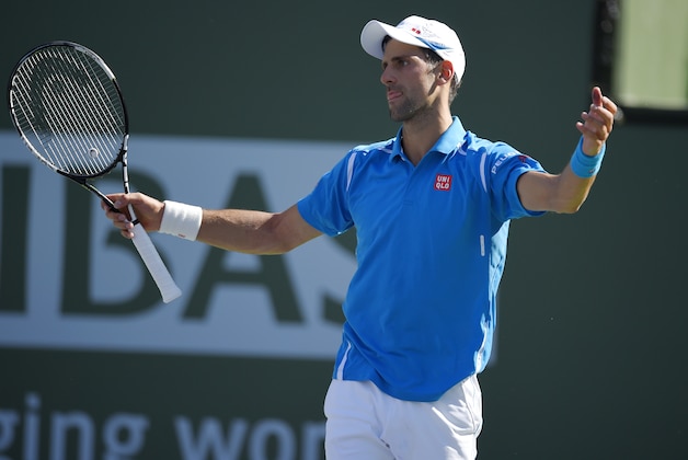 Novak Djokovic, of Serbia, reacts while playing Jo-Wilfried Tsonga, of France, during their quarterfinal match at the BNP Paribas Open tennis tournament, Friday, March 18, 2016, in Indian Wells, Calif. (AP Photo/Mark J. Terrill)