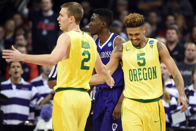 March 18, 2016; Spokane , WA, USA; Oregon Ducks guard Casey Benson (2) and guard Tyler Dorsey (5) celebrates a scoring play against Holy Cross Crusaders in the first round of the 2016 NCAA Tournament during the first half at Spokane Veterans Memorial Arena. Mandatory Credit: Kyle Terada-USA TODAY Sports