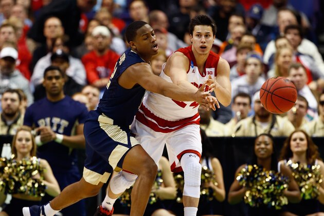 ST LOUIS, MO - MARCH 18:  Bronson Koenig #24 of the Wisconsin Badgers passes the ball against Chris Jones #12 of the Pittsburgh Panthers in the first half of their game during the first round of the 2016 NCAA Men's Basketball Tournament at Scottrade Center on March 18, 2016 in St Louis, Missouri.  (Photo by Jamie Squire/Getty Images)