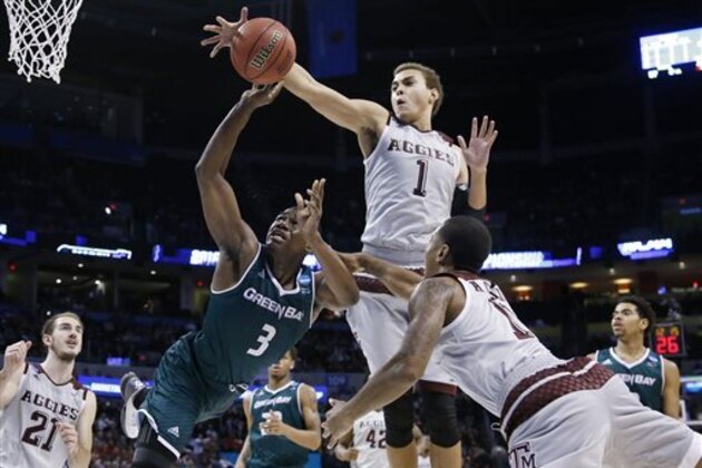 Texas A&M forward D.J. Hogg (1) knocks the ball away from Green Bay guard Khalil Small (3) as Small is fouled by guard Anthony Collins (11) in the second half of a first-round men's college basketball game in the NCAA Tournament, Friday, March 18, 2016, in Oklahoma City. (AP Photo/Sue Ogrocki) Texas A&M forward D.J. Hogg (1) knocks the ball away from Green Bay guard Khalil Small (3) as Small is fouled by guard Anthony Collins (11) in the second half of a first-round men's college basketball game in the NCAA Tournament, Friday, March 18, 2016, in Oklahoma City. (AP Photo/Sue Ogrocki)