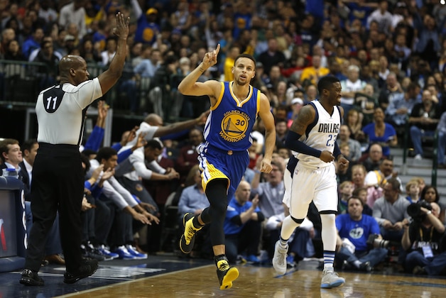 Mar 18, 2016; Dallas, TX, USA;  Golden State Warriors guard Stephen Curry (30) reacts after hitting a three point shot in the first quarter against the Dallas Mavericks American Airlines Center. Mandatory Credit: Tim Heitman-USA TODAY Sports