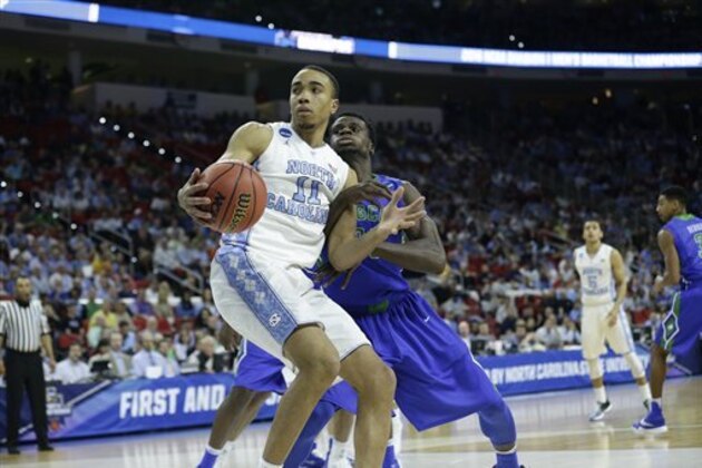 North Carolina forward Brice Johnson (11) works against Florida Gulf Coast during the first half of a first-round men's college basketball game in the NCAA Tournament, Thursday, March 17, 2016, in Raleigh, N.C. (AP Photo/Gerry Broome)