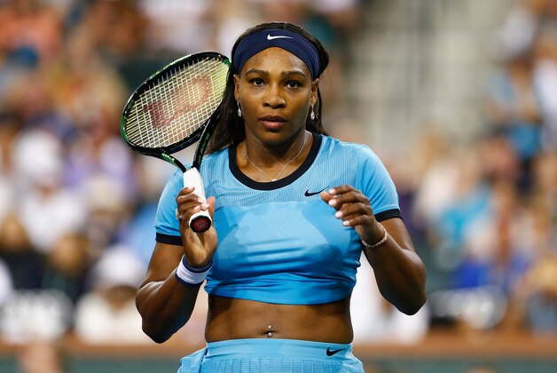 INDIAN WELLS, CA - MARCH 16:  Serena Williams of USA looks on in her match against Simona Halep of Romania during day ten of the BNP Paribas Open at Indian Wells Tennis Garden on March 16, 2016 in Indian Wells, California.  (Photo by Julian Finney/Getty Images)