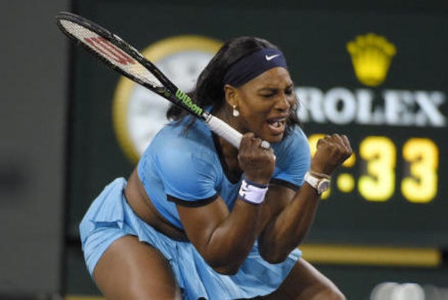 Serena Williams, of the United States, celebrates winning a point against Agnieszka Radwanska, of Poland, during a semifinal at the BNP Paribas Open tennis tournament, Friday, March 18, 2016, in Indian Wells, Calif. Williams won 6-4, 7-6 (1). (AP Photo/Mark J. Terrill)