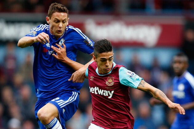 LONDON, ENGLAND - OCTOBER 24:  Manuel Lanzini of West Ham United and Nemanja Matic of Chelsea compete for the ball during the Barclays Premier League match between West Ham United and Chelsea at Boleyn Ground on October 24, 2015 in London, England.  (Photo by Clive Rose/Getty Images)