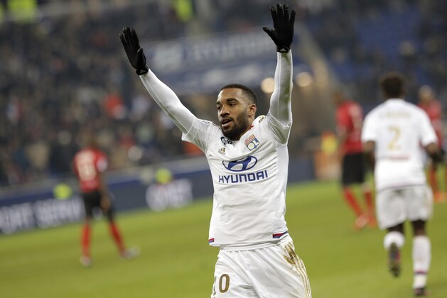 Lyon's Alexandre Lacazette celebrates after scoring a goal  during the French League One soccer match between Lyon and Guingamp in Decines, near Lyon, central France, Sunday, March 6, 2016. (AP Photo/Laurent Cipriani)