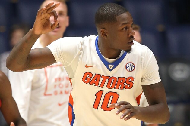 Florida's Dorian Finney-Smith (10) reacts after making a three point basket against Arkansas during the second half of an NCAA college basketball game in the Southeastern Conference tournament in Nashville, Tenn., Thursday, March 10, 2016. (AP Photo/John Bazemore)