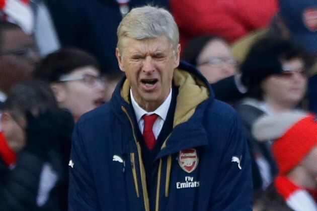 Arsenal's French manager Arsene Wenger reacts in frustration during the second half of the English FA Cup quarterfinal soccer match between Arsenal and Watford at the Emirates stadium in London, Sunday, March 13, 2016.  (AP Photo/Matt Dunham)