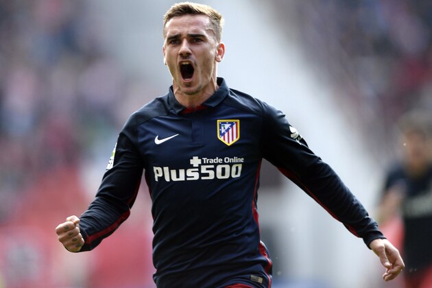 Atletico Madrid's French forward Antoine Griezmann celebrates after scoring a goal during the Spanish league football match Real Sporting de Gijon vs Club Atletico de Madrid at El Molinon stadium in Gijon on March 19, 2016. / AFP / MIGUEL RIOPA        (Photo credit should read MIGUEL RIOPA/AFP/Getty Images)