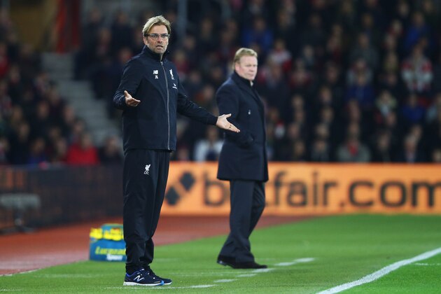SOUTHAMPTON, ENGLAND - DECEMBER 02:  Jurgen Klopp manager of Liverpool gestures as Ronald Koeman manager of Southampton looks on during the Capital One Cup quarter final match between Southampton and Liverpool at St Mary's Stadium on December 2, 2015 in Southampton, England.  (Photo by Clive Rose/Getty Images)
