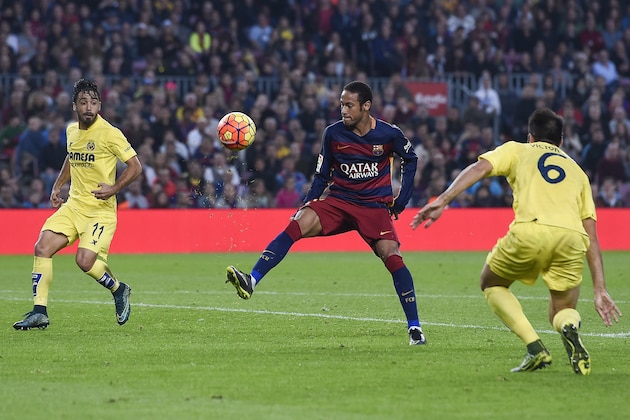Barcelona's Brazilian forward Neymar da Silva Santos Junior (L) controls the ball past Villarreal's defender Jaume Costa (L) during the Spanish league football match FC Barcelona vs Villarreal CF at the Camp Nou stadium in Barcelona on November 8, 2015.   AFP PHOTO/ JOSEP LAGO        (Photo credit should read JOSEP LAGO/AFP/Getty Images)