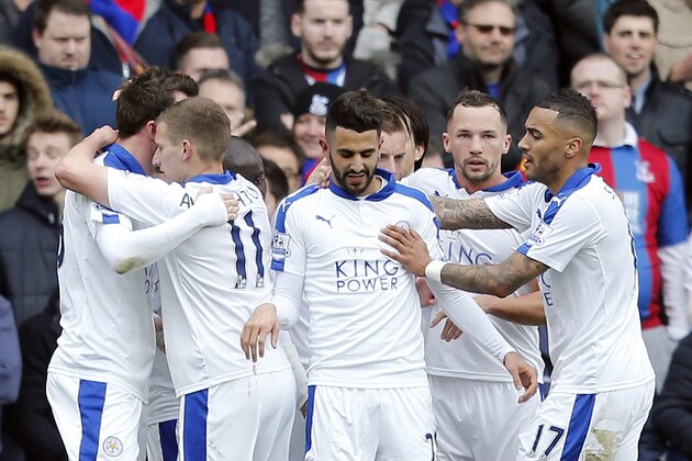 Leicester players celebrate after scoring during the English Premier League soccer match between Crystal Palace and Leicester City at Selhurst Park stadium in London, Saturday, March 19, 2016.(AP Photo/Frank Augstein)