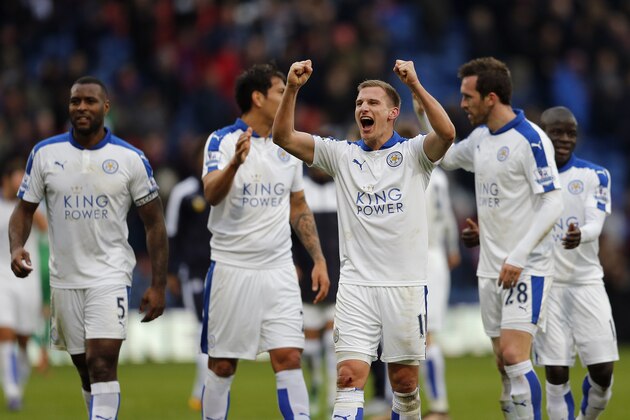 Leicester players celebrate after winning the English Premier League soccer match between Crystal Palace and Leicester City at Selhurst Park stadium in London, Saturday, March 19, 2016.(AP Photo/Frank Augstein)