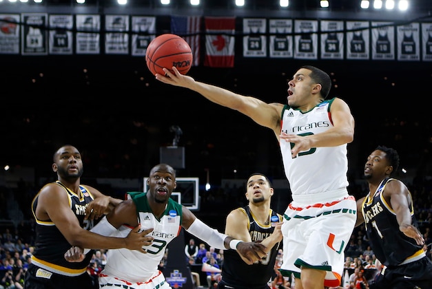 Mar 19, 2016; Providence, RI, USA; Miami (Fl) Hurricanes guard Angel Rodriguez (13) shoots against the Wichita State Shockers during the first half of a second round game of the 2016 NCAA Tournament at Dunkin Donuts Center. Mandatory Credit: Winslow Townson-USA TODAY Sports