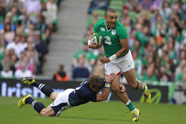 Ireland's Simon Zebo, right, is tackled by Scotland's Peter Horne during their international rugby union match at the Aviva stadium, Dublin, Ireland, Saturday, Aug. 15, 2015.  (AP Photo/Peter Morrison)