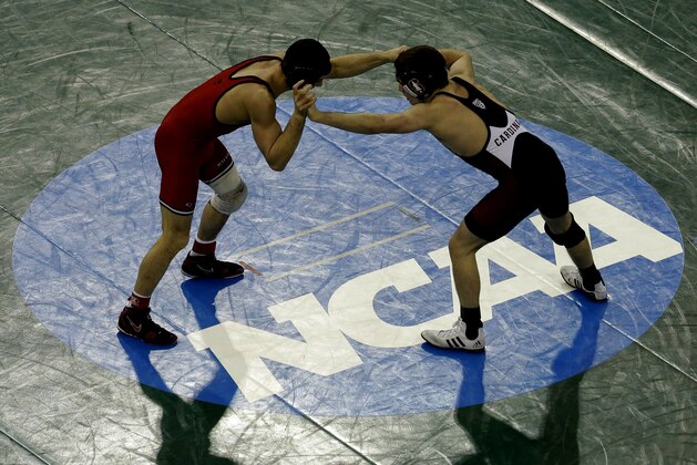 Rutger's Anthony Ashnault, left, locks up with Stanford's Joey McKenna in a 141-pound match during the NCAA Division 1 wrestling championship in New York, Saturday, March 19, 2016. McKenna defeated Ashnault for a third place finish. (AP Photo/Seth Wenig)