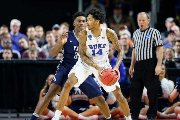 Mar 19, 2016; Providence, RI, USA; Duke Blue Devils guard Brandon Ingram (14) looks to pass around  Yale Bulldogs forward Brandon Sherrod (35) during the first half of a second round game of the 2016 NCAA Tournament at Dunkin Donuts Center. Mandatory Credit: Winslow Townson-USA TODAY Sports