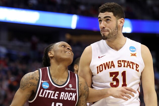 DENVER, CO - MARCH 19:  Marcus Johnson Jr. #13 of the Arkansas Little Rock Trojans jokes with Georges Niang #31 of the Iowa State Cyclones on in the first half during the second round of the 2016 NCAA Men's Basketball Tournament at the Pepsi Center on March 19, 2016 in Denver, Colorado.  (Photo by Sean M. Haffey/Getty Images)