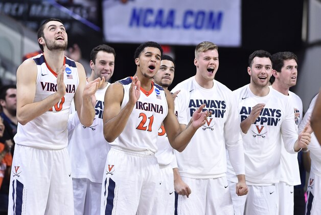 Mar 19, 2016; Raleigh, NC, USA; The Virginia Cavaliers bench celebrate after scoring against the Butler Bulldogs in the second half during the second round of the 2016 NCAA Tournament at PNC Arena. Mandatory Credit: Bob Donnan-USA TODAY Sports
