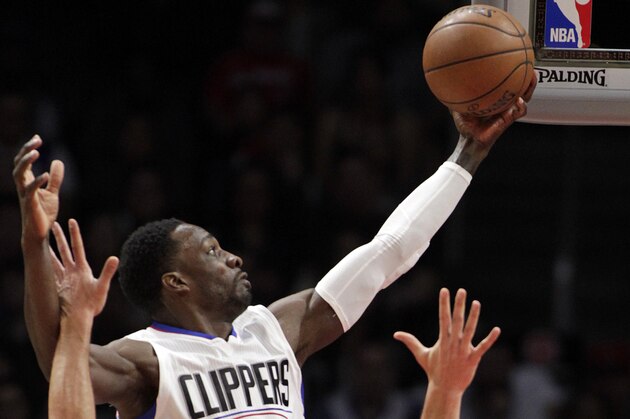 Los Angeles Clippers forward Jeff Green (8) goes up against Denver Nuggets center Joffrey Lauvergne (77) and guard D.J. Augustin (12) during the second half of an NBA basketball game in Los Angeles, Wednesday, Feb. 24, 2016. The Nuggets won 87-81. (AP Photo/Alex Gallardo) Los Angeles Clippers forward Jeff Green (8) goes up against Denver Nuggets center Joffrey Lauvergne (77) and guard D.J. Augustin (12) during the second half of an NBA basketball game in Los Angeles, Wednesday, Feb. 24, 2016. The Nuggets won 87-81. (AP Photo/Alex Gallardo)