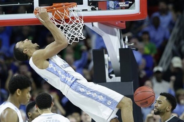 North Carolina forward Brice Johnson (11) reacts after dunking the ball against Providence guard Jalen Lindsey (21) during the second half of a second-round men's college basketball game in the NCAA Tournament, Saturday, March 19, 2016, in Raleigh, N.C. (AP Photo/Gerry Broome)