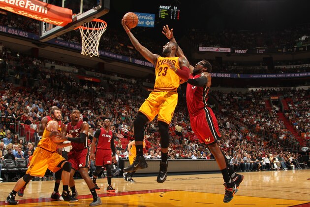 MIAMI, FL - MARCH 19: LeBron James #23 of the Cleveland Cavaliers shoots the ball against the Miami Heat  on March 19, 2016 at AmericanAirlines Arena in Miami, Florida. NOTE TO USER: User expressly acknowledges and agrees that, by downloading and or using this Photograph, user is consenting to the terms and conditions of the Getty Images License Agreement. Mandatory Copyright Notice: Copyright 2015 NBAE (Photo by Issac Baldizon/NBAE via Getty Images)