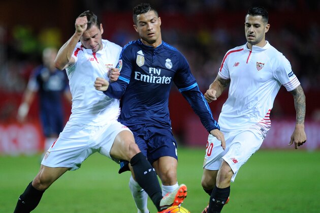 SEVILLE, SPAIN - NOVEMBER 08:  Grzegorz Krychowiak of Sevilla FC cuts off Cristiano Ronaldo of Real Madrid during the La Liga match between Sevilla FC and Real Madrid CF at Estadio Ramon Sanchez Pizjuan on November 8, 2015 in Seville, Spain.  (Photo by Denis Doyle/Getty Images)