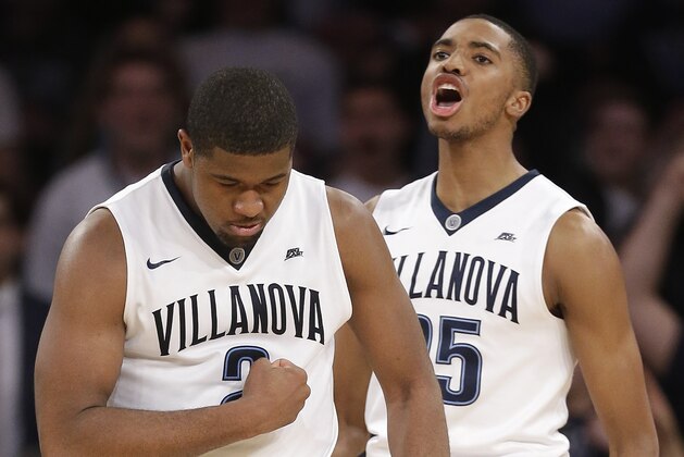 Villanova forward Kris Jenkins (2) and guard Mikal Bridges (25) react after a basket by Jenkins against Providence in the second half of an NCAA college basketball game during the semifinals of the Big East men's tournament, Friday, March 11, 2016, in New York. (AP Photo/Julie Jacobson)