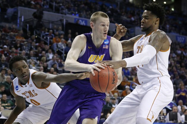 Northern Iowa guard Paul Jesperson, center, drives between Texas guard Tevin Mack (0) and center Prince Ibeh during the first half of a first-round men's college basketball game in the NCAA Tournament, Friday, March 18, 2016, in Oklahoma City. Northern Iowa won 75-72. (AP Photo/Sue Ogrocki)