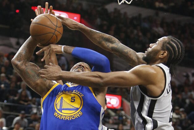 SAN ANTONIO, TX - MARCH 19: Marreese Speights #5 of the Golden States Warriors has his shot blocked by Kawhi Leonard #2 of the San Antonio Spurs  at AT&T Center on March 19, 2016 in San Antonio, Texas.  NOTE TO USER: User expressly acknowledges and agrees that , by downloading and or using this photograph, User is consenting to the terms and conditions of the Getty Images License Agreement. (Photo by Ronald Cortes/Getty Images)
