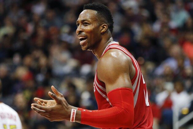 Houston Rockets center Dwight Howard (12) reacts after being called for a foul in the first half of an NBA basketball game against the Atlanta Hawks  Saturday, March 19, 2016, in Atlanta. (AP Photo/John Bazemore)