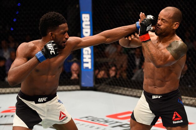 BRISBANE, AUSTRALIA - MARCH 20:  (L-R) Neil Magny of the United States punches Hector Lombard of Cuba in their welterweight bout during the UFC Fight Night event at the Brisbane Entertainment Centre on March 20, 2016 in Brisbane, Australia. (Photo by Josh Hedges/Zuffa LLC/Zuffa LLC via Getty Images)