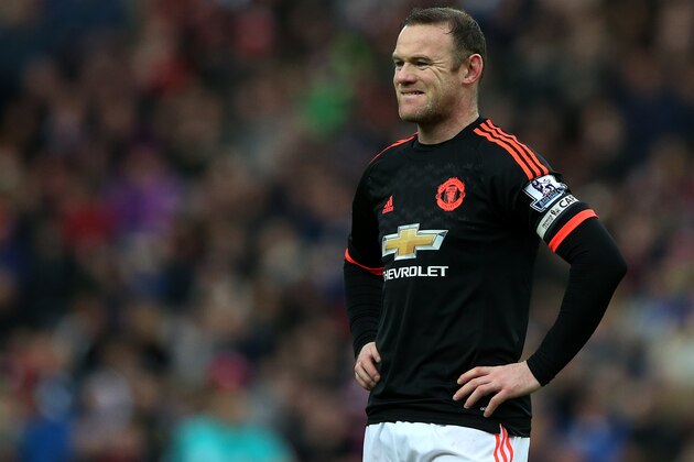 Manchester United's captain Wayne Rooney stands dejected as Sunderland's Wahbi Khazri celebrates his goal during the English Premier League soccer match between Sunderland and Manchester United at the Stadium of Light, Sunderland, England, Saturday, Feb. 13, 2016. (AP Photo/Scott Heppell)