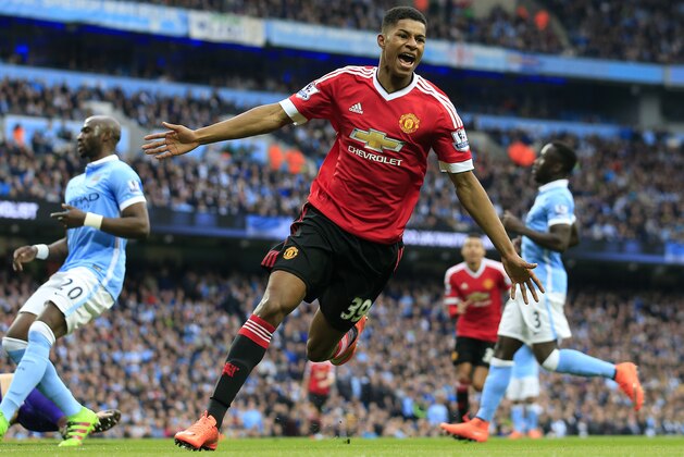 United’s Marcus Rashford celebrates after scoring his side's first goal during the English Premier League soccer match between Manchester City and Manchester United at the Etihad stadium in Manchester, Sunday, March 20, 2016.(AP Photo/Jon Super)