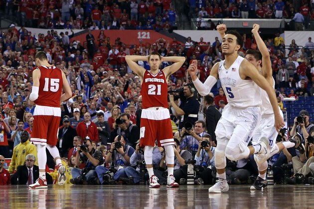 INDIANAPOLIS, IN - APRIL 06: Tyus Jones #5 and Grayson Allen #3 of the Duke Blue Devils celebrate after defeating the Wisconsin Badgers as Sam Dekker #15 and Josh Gasser #21 look on during the NCAA Men's Final Four National Championship at Lucas Oil Stadium on April 6, 2015 in Indianapolis, Indiana. Duke defeated Wisconsin 68-63. (Photo by Andy Lyons/Getty Images)