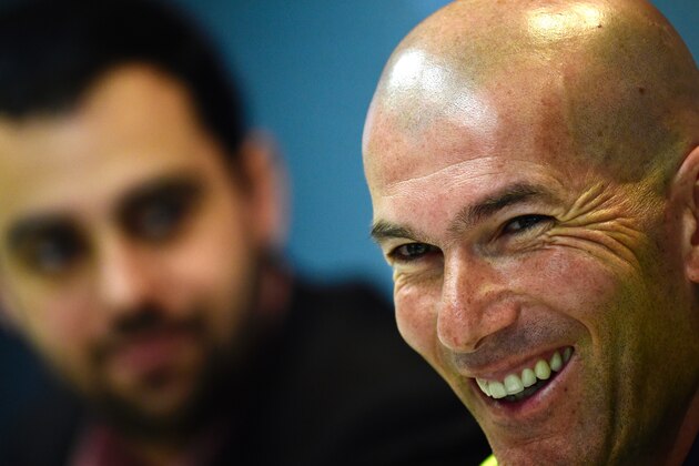 Real Madrid's French coach Zinedine Zidane smiles during a press conference after a training session at Valdebebas Sport City in Madrid on March 19, 2016 on the eve of their Liga football match against Sevilla. / AFP / PIERRE-PHILIPPE MARCOU        (Photo credit should read PIERRE-PHILIPPE MARCOU/AFP/Getty Images)
