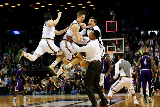 NEW YORK, NY - MARCH 20:  Rex Pflueger #0 of the Notre Dame Fighting Irish and teammates celebrate their 76 to 75 win over the Stephen F. Austin Lumberjacks during the second round of the 2016 NCAA Men's Basketball Tournament at Barclays Center on March 20, 2016 in the Brooklyn borough of New York City.  (Photo by Elsa/Getty Images)