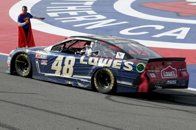 FONTANA, CA - MARCH 20:  A crew member of the #48 Lowe's / Superman Chevrolet, driven by Jimmie Johnson, walks to the car after winning the NASCAR Sprint Cup Series Auto Club 400 at Auto Club Speedway on March 20, 2016 in Fontana, California.  (Photo by Jeff Gross/Getty Images)