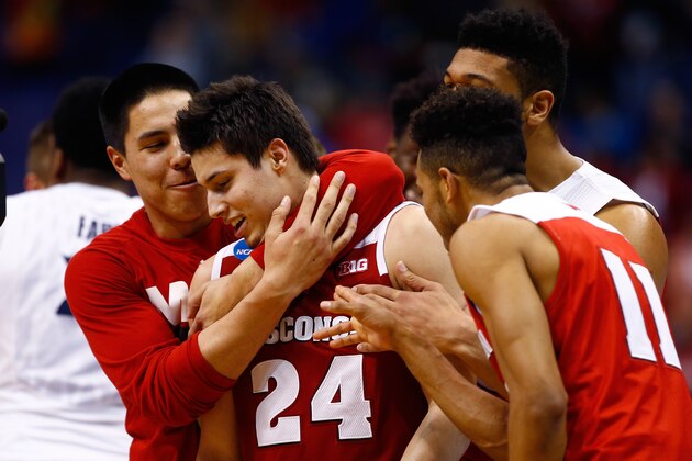 ST LOUIS, MO - MARCH 20: Bronson Koenig #24 of the Wisconsin Badgers celebrates with teammates after making the game winning buzzer beater basket against the Xavier Musketeers during the second round of the 2016 NCAA Men's Basketball Tournament at Scottrade Center on March 20, 2016 in St Louis, Missouri.  (Photo by Jamie Squire/Getty Images)