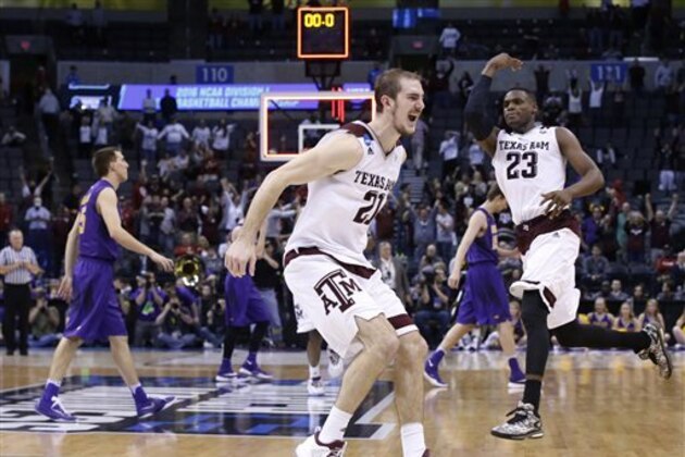 Texas A&M guard Alex Caruso, left, and guard Danuel House (23) celebrate as Northern Iowa players walk off the court after defeating Northern Iowa in double overtime of a second-round men's college basketball game in the NCAA Tournament Sunday, March 20, 2016, in Oklahoma City. Texas A&M won 92-88. (AP Photo/Sue Ogrocki)