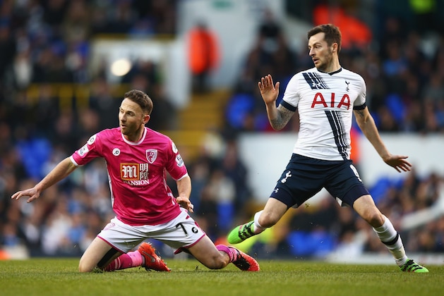 LONDON, ENGLAND - MARCH 20:  Marc Pugh of Bournemouth is challenged by Ryan Mason of Tottenham Hotspur during the Barclays Premier League match between Tottenham Hotspur and A.F.C. Bournemouth at White Hart Lane on March 20, 2016 in London, United Kingdom.  (Photo by Paul Gilham/Getty Images)